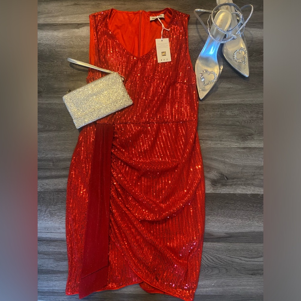 Beautiful red sequin dress. Fits dress size 12. Never worn.
